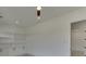 Spacious bedroom with built-in shelving and ceiling fan at 553 Versailles Dr, Auburn, GA 30011