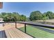 Deck overlooking a fenced backyard with green lawn at 553 Versailles Dr, Auburn, GA 30011