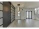 Modern dining room with statement chandelier and gray and black wall details at 553 Versailles Dr, Auburn, GA 30011