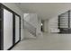 Bright entryway with modern staircase and frosted glass doors at 553 Versailles Dr, Auburn, GA 30011