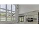 Open concept great room with kitchen and wall of windows at 553 Versailles Dr, Auburn, GA 30011