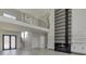 Two-story great room features a modern fireplace and stunning architectural details at 553 Versailles Dr, Auburn, GA 30011