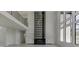 Soaring ceilings and walls of windows highlight this great room at 553 Versailles Dr, Auburn, GA 30011