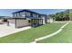 Modern home with white brick exterior and large backyard at 553 Versailles Dr, Auburn, GA 30011