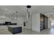 Modern kitchen boasts white cabinets, marble island, and a breakfast bar at 553 Versailles Dr, Auburn, GA 30011