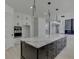 Open concept kitchen boasting a sizable island and sleek countertops at 553 Versailles Dr, Auburn, GA 30011