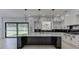 Modern kitchen with a large island and plenty of cabinet space at 553 Versailles Dr, Auburn, GA 30011