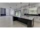 Eat-in kitchen features an expansive island and opens to a bright living area at 553 Versailles Dr, Auburn, GA 30011