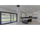 Modern kitchen boasts white cabinets, marble island, and a breakfast bar at 553 Versailles Dr, Auburn, GA 30011