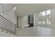Spacious living room with hardwood floors, fireplace, and large windows at 553 Versailles Dr, Auburn, GA 30011