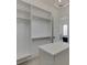 Large walk-in closet with island and ample shelving at 553 Versailles Dr, Auburn, GA 30011