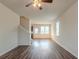 Open living room with hardwood floors and stairs at 11055 Shadow Ct, Hampton, GA 30228