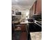 Compact kitchen with wood cabinets and essential appliances at 2805 Macon Se Dr # 26E, Atlanta, GA 30354