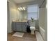 Clean bathroom with a grey vanity and a bathtub at 303 Latimer Se St, Marietta, GA 30008