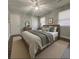 Spacious primary bedroom with a wooden bed frame and neutral decor at 303 Latimer Se St, Marietta, GA 30008