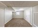 Unfinished basement featuring neutral walls, carpet flooring, and a window at 3670 Leisure Ln, Atlanta, GA 30349