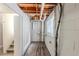 Unfinished basement with exposed ceiling, concrete block walls, and a small window at 3670 Leisure Ln, Atlanta, GA 30349