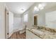 Bathroom featuring a granite countertop vanity and tile flooring at 3670 Leisure Ln, Atlanta, GA 30349