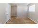 Bedroom with neutral walls, carpet flooring, and a window at 3670 Leisure Ln, Atlanta, GA 30349