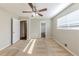 Bedroom with neutral walls, carpet flooring, ceiling fan and a window at 3670 Leisure Ln, Atlanta, GA 30349