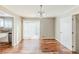 Dining room features hardwood floors, a modern chandelier, and sliding glass doors at 3670 Leisure Ln, Atlanta, GA 30349