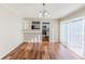 Dining room with hardwood floors, slider to back yard, and open to the kitchen at 3670 Leisure Ln, Atlanta, GA 30349