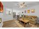 Bright living room with comfy couch, wood coffee table, and fireplace at 1625 Island Way, Buford, GA 30519