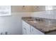 Bright bathroom with granite vanity top, and white subway tile surround at 2424 West Rd, Riverdale, GA 30296