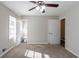 Bedroom featuring neutral walls, carpet, closet, and doorway to an ensuite bathroom at 2424 West Rd, Riverdale, GA 30296
