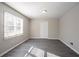 This bedroom features luxury vinyl plank flooring and a spacious closet at 2424 West Rd, Riverdale, GA 30296