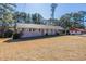 Charming single-story home with a covered carport and a well-maintained front yard at 2424 West Rd, Riverdale, GA 30296