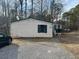 Mobile home with green metal roof and screened porch at 4821 Ryan Rd, Acworth, GA 30102