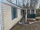 Side view of a mobile home with a screened porch at 4821 Ryan Rd, Acworth, GA 30102