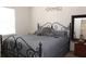 Bedroom with queen-size bed and iron frame at 7229 Deering Ct, Douglasville, GA 30134