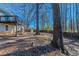 Large backyard with mature trees and a shed at 3887 Mcgill Ln, Decatur, GA 30034
