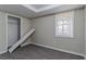Spacious basement bedroom with grey carpet and large window at 3887 Mcgill Ln, Decatur, GA 30034