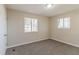 Well-lit bedroom featuring neutral walls and carpet at 3887 Mcgill Ln, Decatur, GA 30034