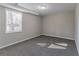 Basement bedroom with grey carpet and window at 3887 Mcgill Ln, Decatur, GA 30034