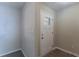 Bright and airy entryway with neutral colors and wood-look flooring at 3887 Mcgill Ln, Decatur, GA 30034