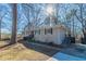 Updated ranch home exterior with attractive landscaping and a large yard at 3887 Mcgill Ln, Decatur, GA 30034