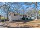 Side view of charming ranch home with newly painted exterior and well-manicured lawn at 3887 Mcgill Ln, Decatur, GA 30034