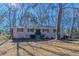 Ranch style home with white brick exterior, updated landscaping, and a spacious yard at 3887 Mcgill Ln, Decatur, GA 30034