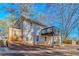 Back of house with deck and a sloped yard at 3887 Mcgill Ln, Decatur, GA 30034