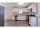 Modern kitchen featuring stainless steel appliances and granite countertops at 3887 Mcgill Ln, Decatur, GA 30034