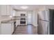Updated kitchen with stainless steel appliances and granite countertops at 3887 Mcgill Ln, Decatur, GA 30034