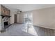 Spacious living area with stone fireplace and access to a deck at 3887 Mcgill Ln, Decatur, GA 30034