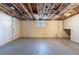 Unfinished basement features white walls, concrete floors, and exposed ceiling at 5938 Baywood Ln, Riverdale, GA 30296