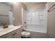 Bright bathroom with a white vanity, tub-shower combo, and clean fixtures that offers a pristine, spa-like retreat at 5938 Baywood Ln, Riverdale, GA 30296