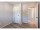 Vacant bedroom featuring wood-look floors, neutral walls, and a doorway that would make a comfortable space at 5938 Baywood Ln, Riverdale, GA 30296