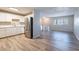 Bright kitchen area featuring stainless steel appliances, hardwood floors, with an attached living area at 5938 Baywood Ln, Riverdale, GA 30296